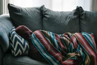 Person lying on couch