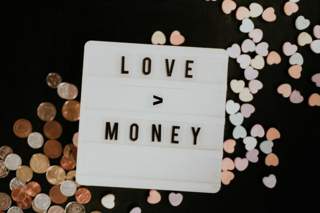 Image of a sign saying Love and Money