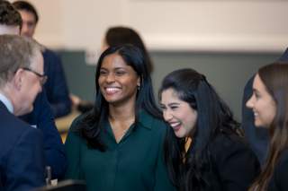 group of people laughing and chatting